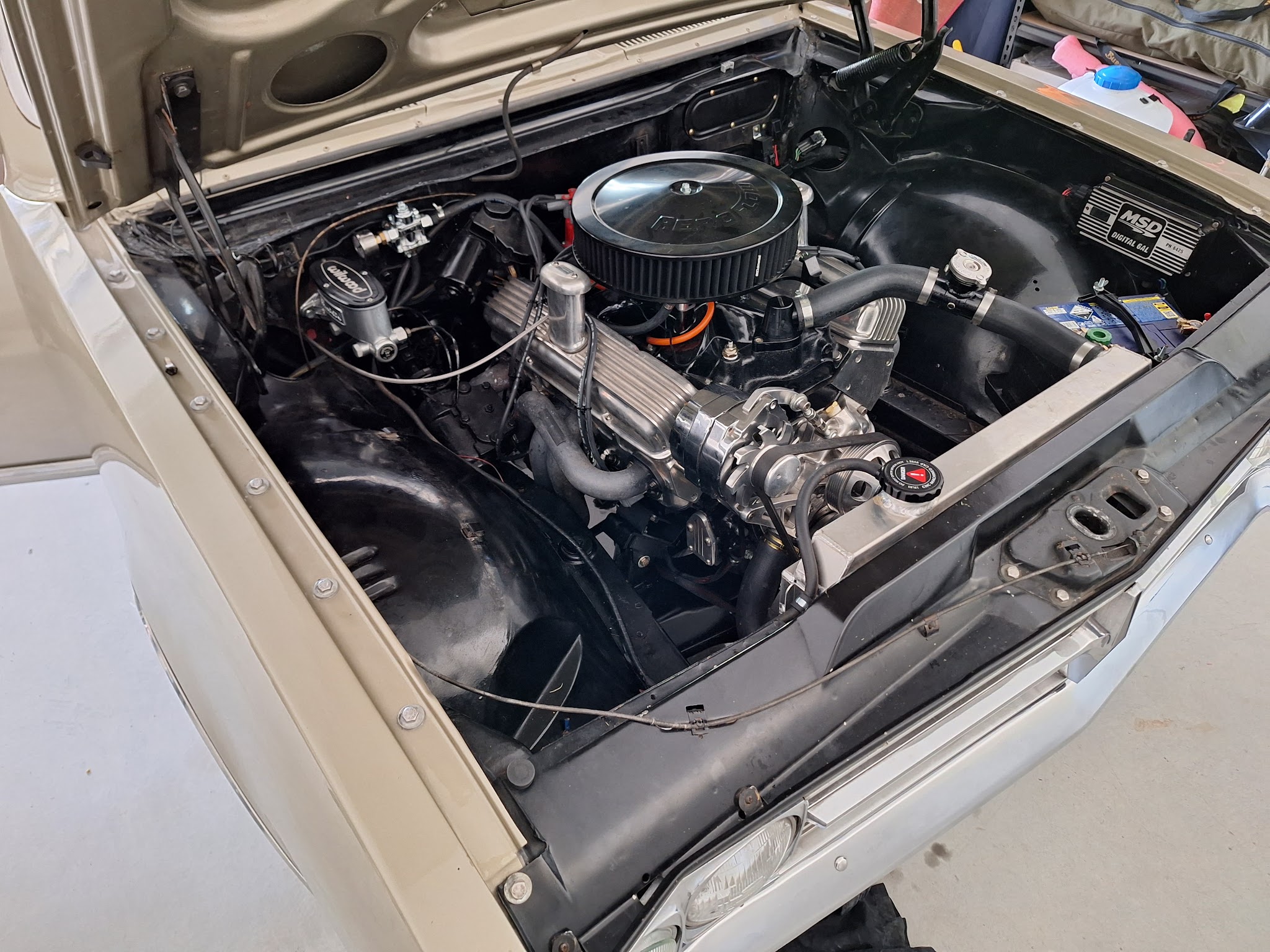 Classic engine bay with an MSD Digital 6AL ignition box and a Wilwood master cylinder fitted