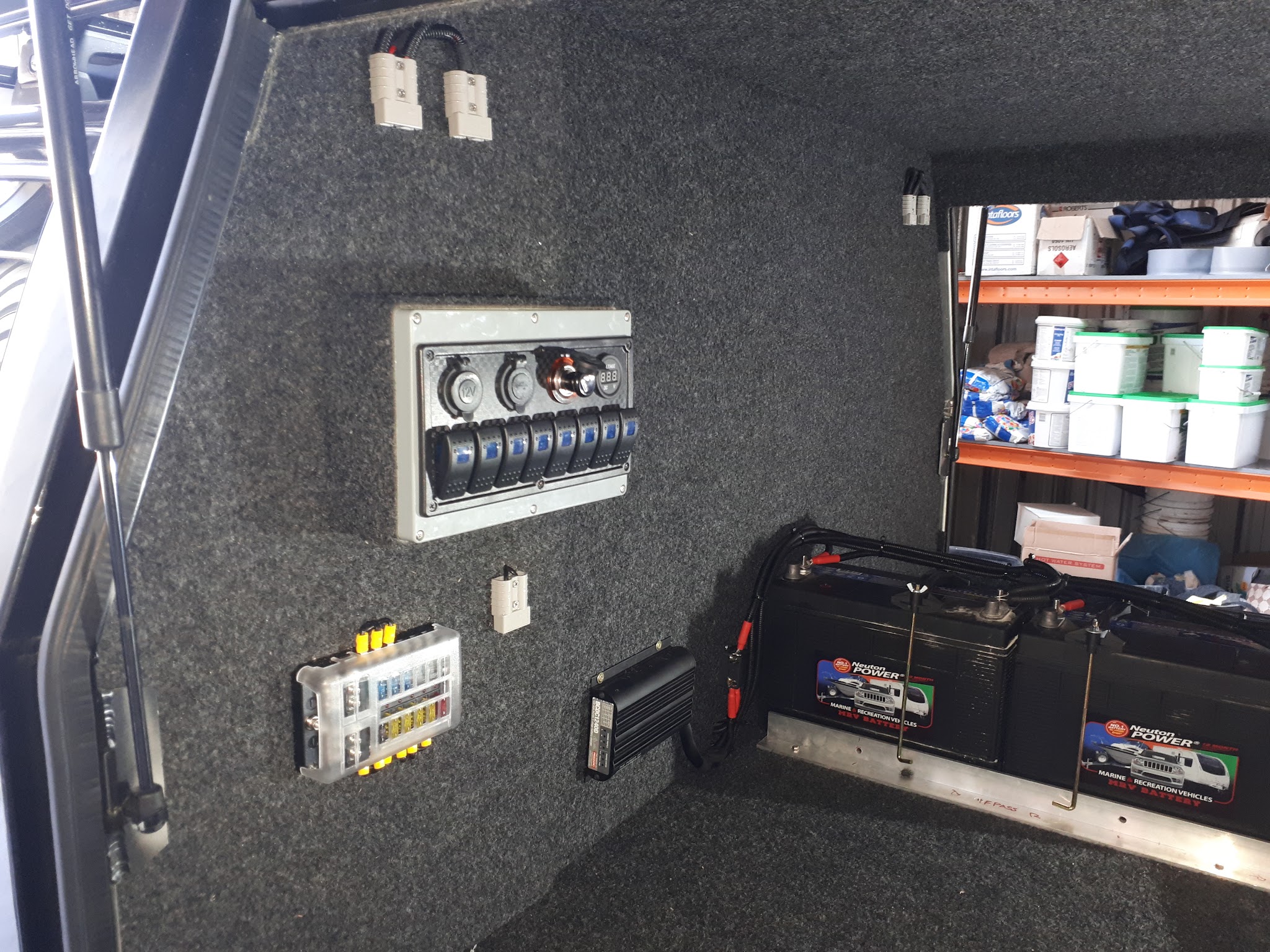 Dual battery setup in a 4WD canopy with a switch panel, fuse block and two deep cycle batteries